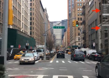 una calle con coches y edificios